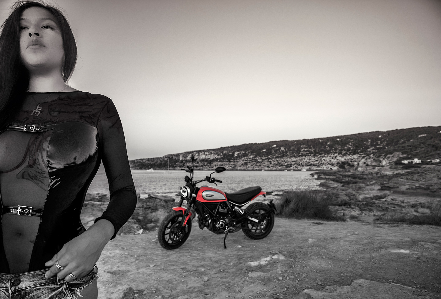 Sexy girl with tattoo and motorcycle at Es Calo beach, Formentera, Spain, (Nos Dren).