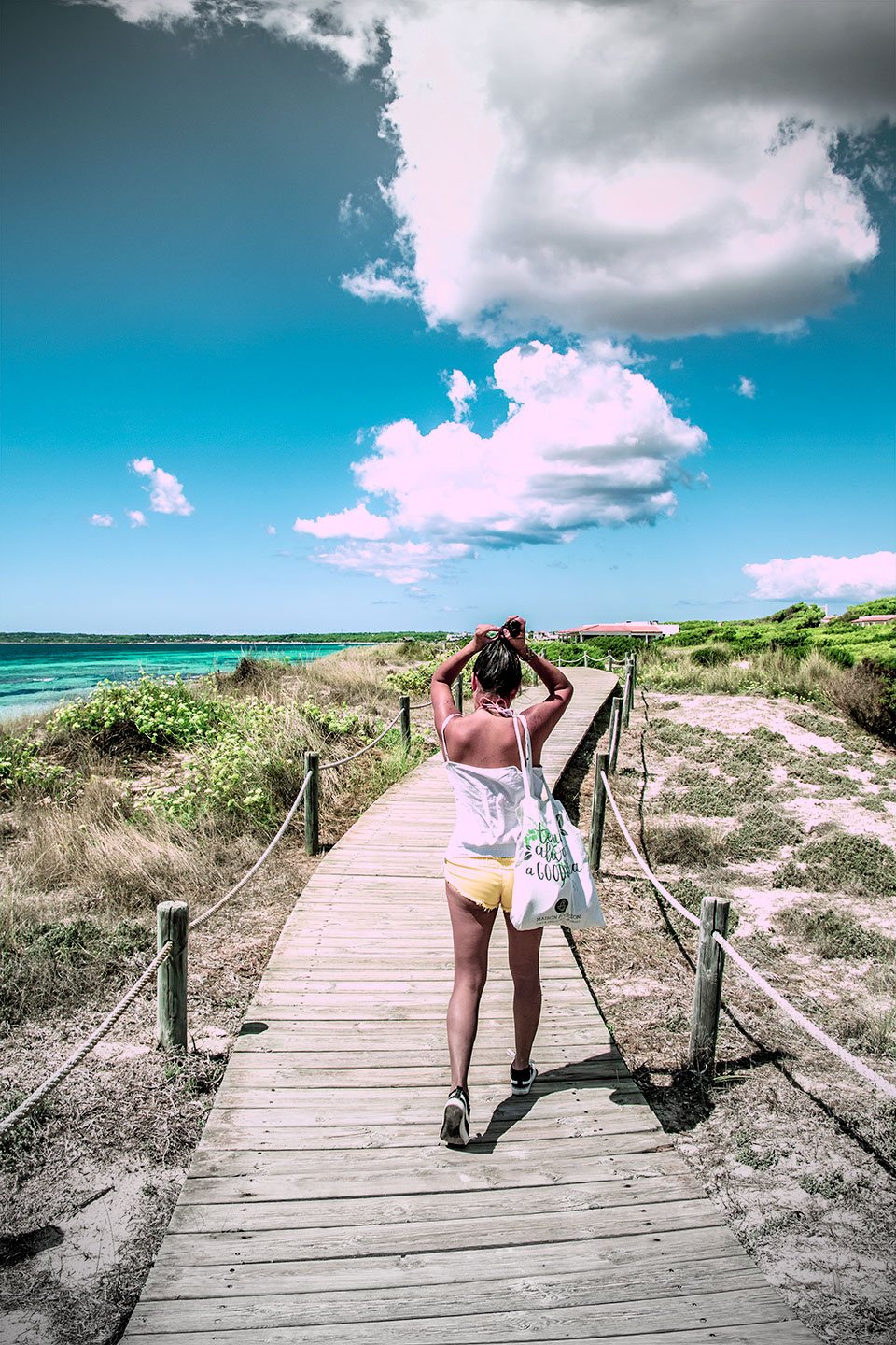 Sexy girl with yellow short at Es Cavall d'en Borras beach, Formentera, Spain, (Nos Dren).