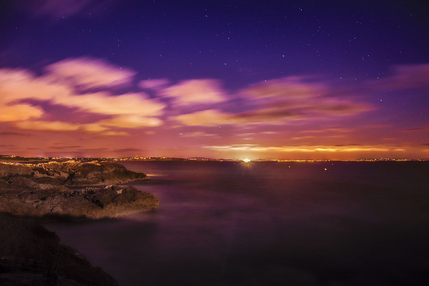 Slow speed shutter night photography above Ibiza from Es Calo, Spain, (Nos Dren).