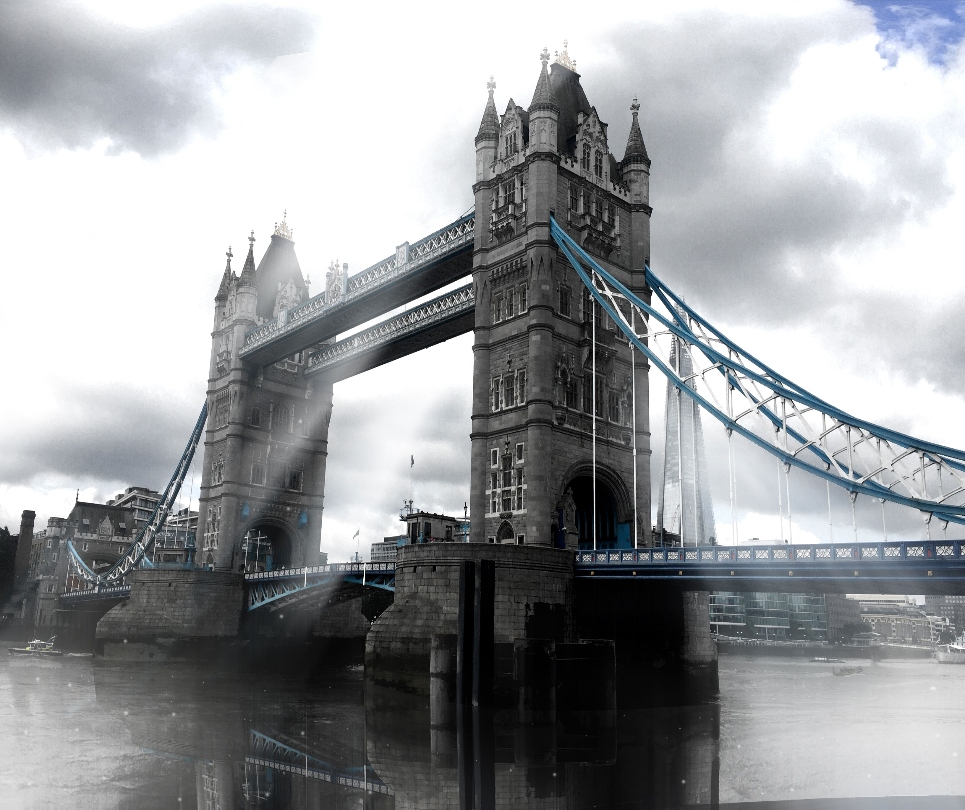 The London Tower Bridge of London, UK, almost black and white, with cloudy light rays, (Nos Dren).