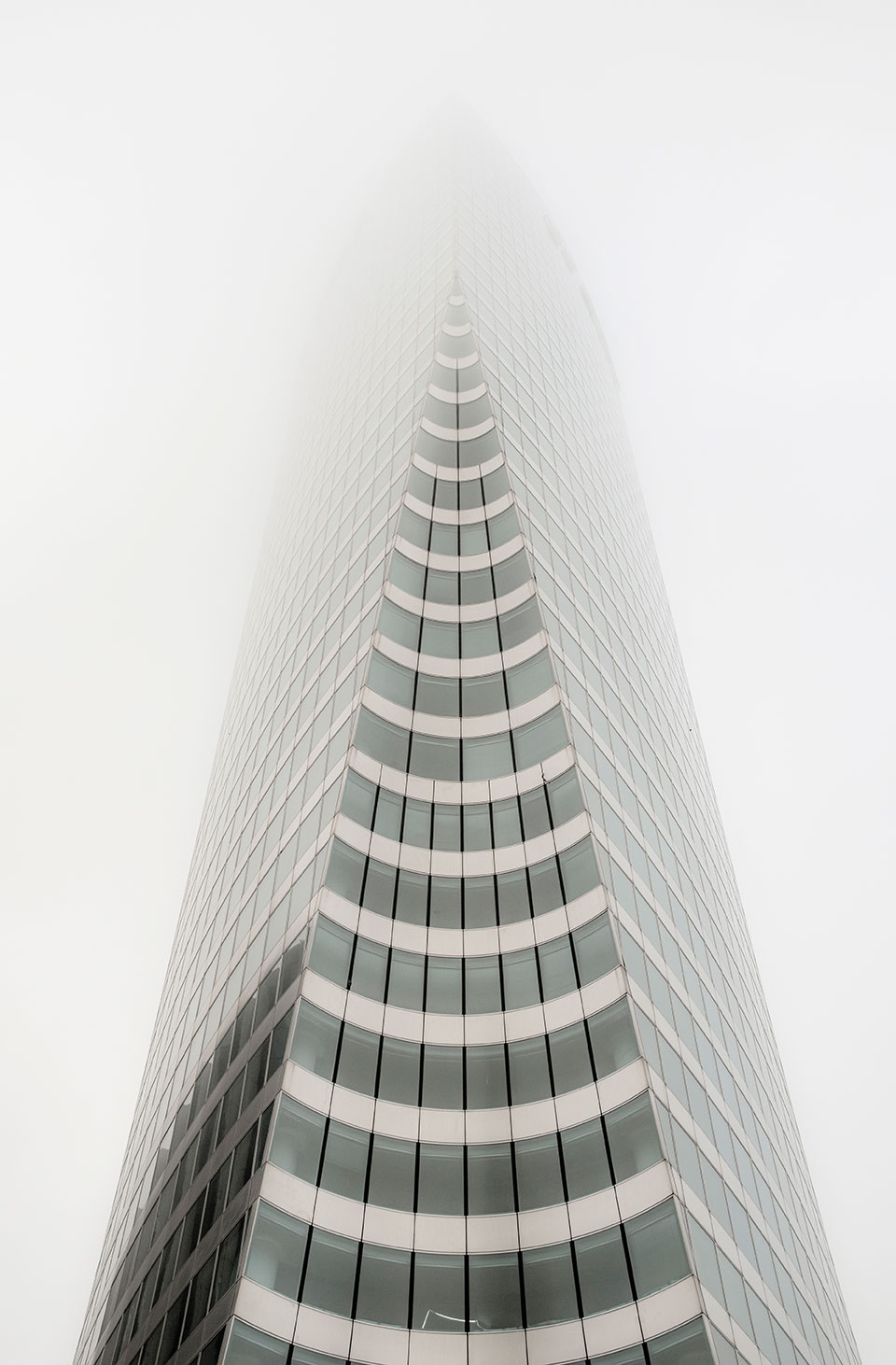Mist and fog through the skyscrapers of Paris La Defense, France. (Nos Dren)