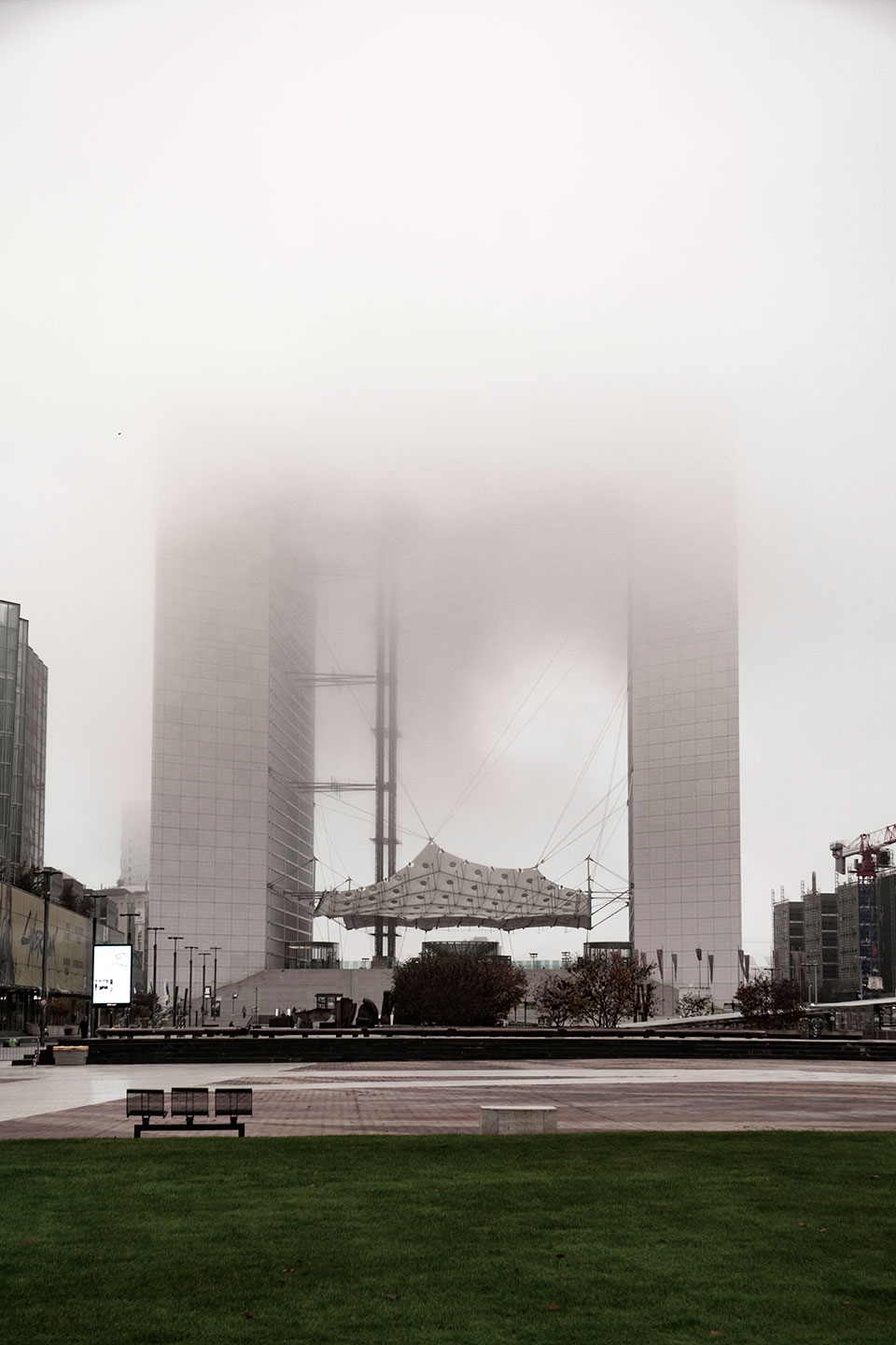 Mist and fog through the skyscrapers of Paris La Defense, France. (Nos Dren)