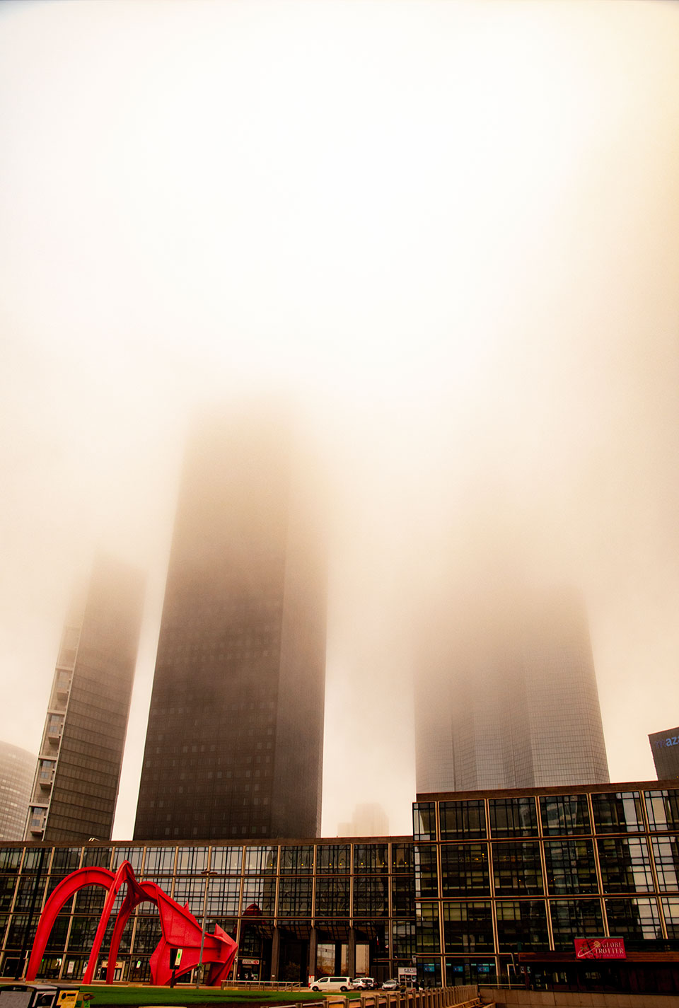 Mist and fog through the skyscrapers of Paris La Defense, France. (Nos Dren)