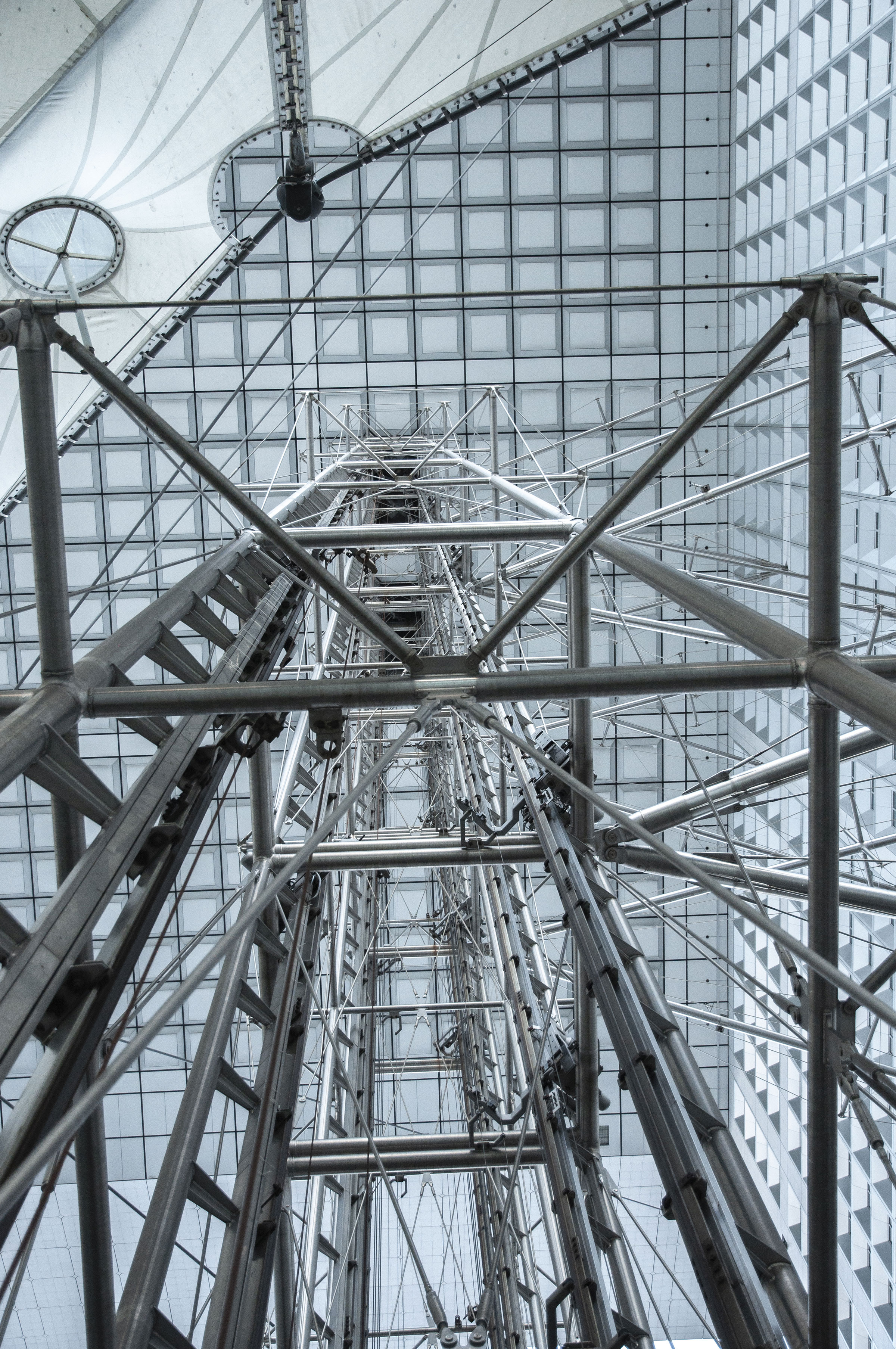 Abstract architecture photographie from under the Arch of La Défense, Paris, France. (Nos Dren)