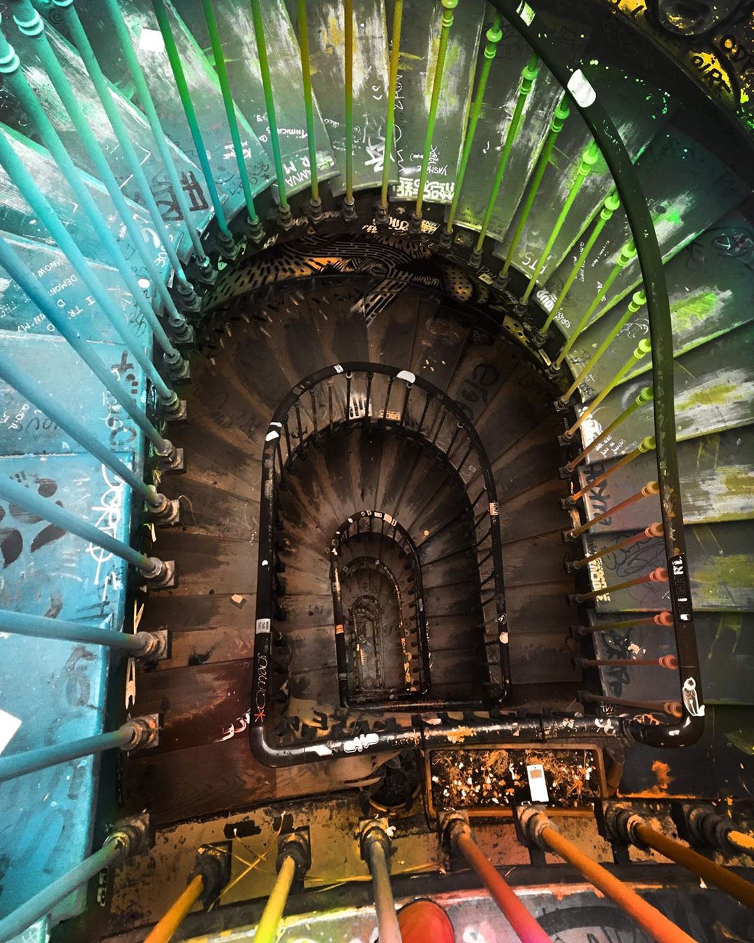 Colorful stair case from above with nice perspective, from the 59 Rivoli artist house in Paris, France. (Nos Dren)