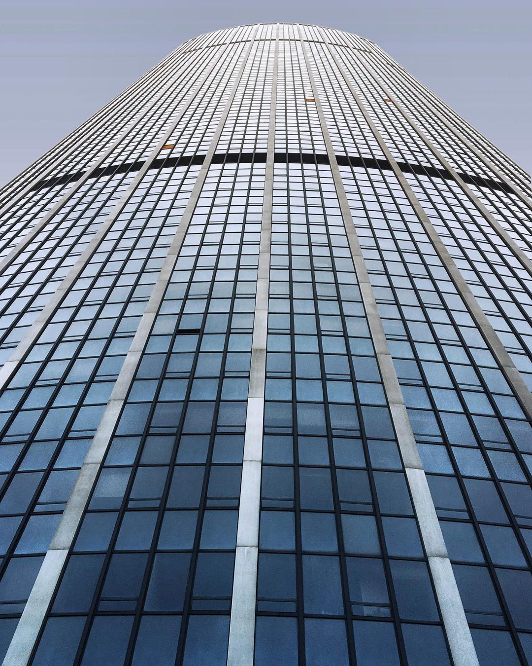The Montparnasse tower building view from the bottom with perspective, took in Paris, France. (Nos Dren)