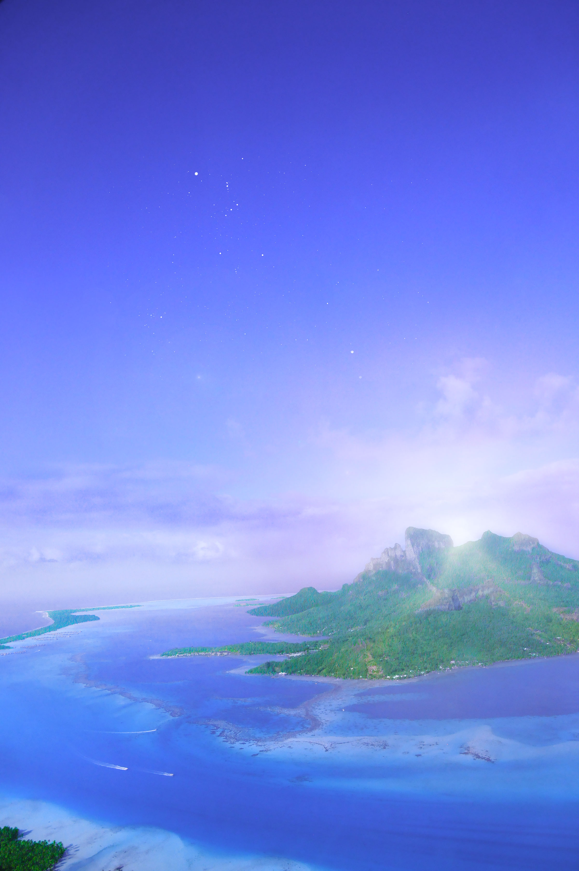 French Polynesia, Bora Bora island, view from the sky above the blue lagoon and mount Otemanu. (Nos Dren)