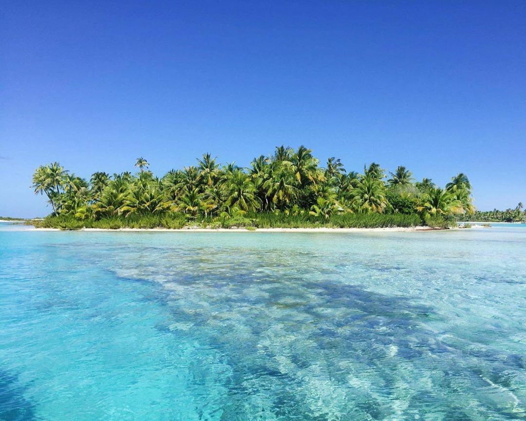 French Polynesia, Bora Bora island, wild desert island in the middle of the Pacific Ocean, crystal blue water and many palm trees. (Nos Dren)